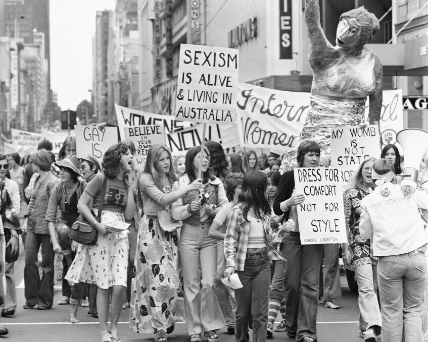 MAKING A POINT: A young crowd makes its way along the streets of Melbourne on International Women's Day on March 8, 1975.