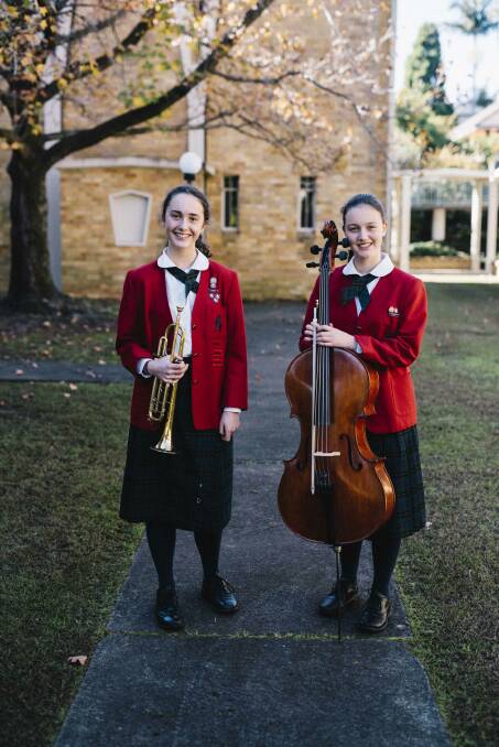 RIGHT NOTE: Charlotte and Emma Russell from All Saints' learnt from the Australian Romantic and Classical Orchestra.