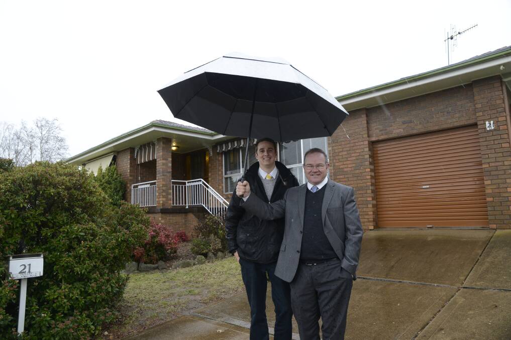 HOMES TO BE HAD: Ray White Emms Mooney sales specialists Kurt Waterford and Mark Sullivan outside a Windradyne home suitable for young buyers. Photo: PHILL MURRAY	 062416pyoung