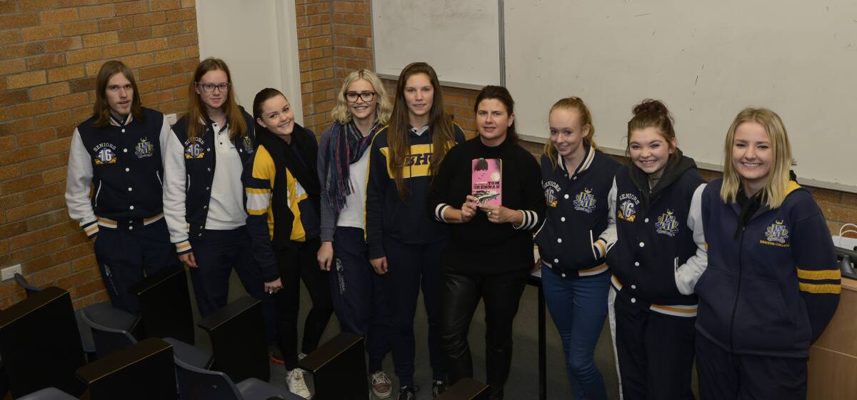 LESSONS TO LEARN: Denison College-Bathurst High Campus Year 12 students Ben Sandry, Abbey Hardie, Bella Driscoll, Olivia Cafe, Annabel Meadley, Ashley Bell, Ali Lewis and Brianna Underhill, with author JC Burke (fourth from right) at Tuesday’s HSC seminars. 	 062116phcs