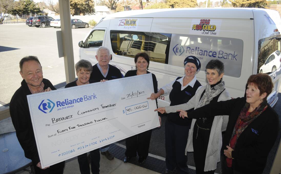 CHEQUE THIS OUT: Reliance Bank CEO Mark Genovese with a cheque for $45,000 for another three-year sponsorship of the Bathurst Community Transport radiation bus. He is pictured with Bathurst Community Transport executive officer Leonie Schumacher, co-ordinators Mick Williamson, Sarah Jones and Kim Hastings, former bus user Varni-Maree Bennett and administration volunteer Trish Shoesmith. Photo: CHRIS SEABROOK 072517cbus