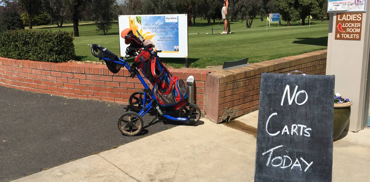 SNAPSHOT: Despite ongoing rain, Friday was only the third time this sign has been put up for Bathurst golfers. Photo: NADINE MORTON 092316nmsnap4