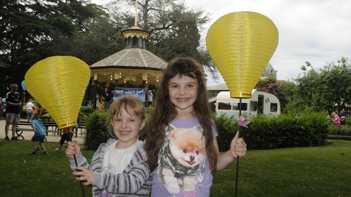 HAPPY: Sarah, 4, and Lila Williams, 7, took part in the Bathurst Light the Night event.