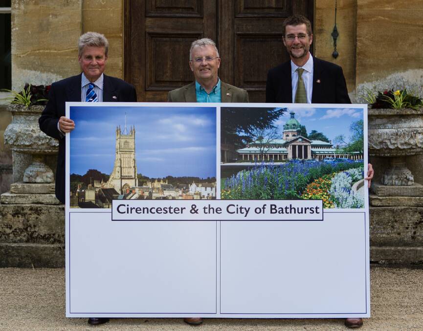 GOOD FRIENDS: Earl Bathurst, Andy Lennard of the Cirencester Community Development Trust and Cr Mark Harris of Cirencester Town Council with the giant postcard to be sent to Bathurst.