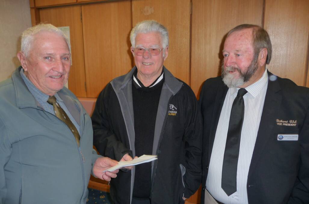 SUPPORT: Bathurst University of the Third Age president Lindsay Cox receives a ClubGRANT from Norm Mann of Panthers Bathurst and Ron Hollebone of Bathurst RSL at a presentation in the Bathurst Regional Council chambers.