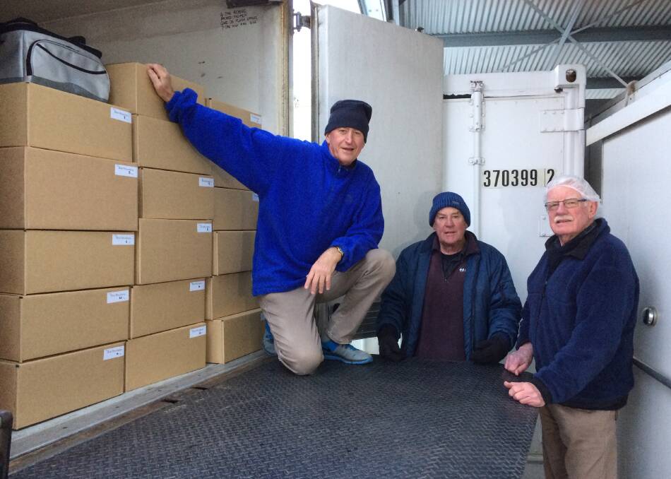 BOXED IN: Bathurst Meals on Wheels volunteer driver Jerry Rybak, dispatcher Brian Greatorex, and director Graham Priddle with a truck packed with more than 130 boxes of frozen meals to be delivered to Nepean customers. 