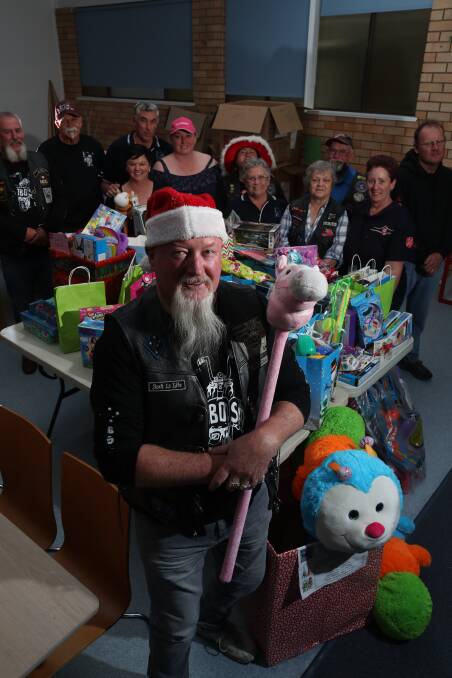GOOD RUN: Bob Hancock and the Bathurst and District Hobos and Panorama Motorcycle clubs at the Salvation Army after their toy run. Photo: PHIL BLATCH 120217pbsalvos2