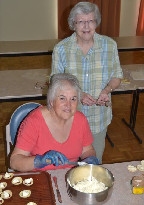 BAKERS' DELIGHT: Diane Fraser and Isobel Brainwood were busy on Thursday preparing for the Holy Trinity Kelso Market Day.