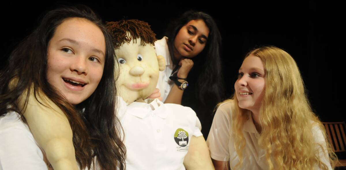 SNAPSHOT: Nyuaki Pearce, Moumita Paul and Georgia Masters perform a scene from the play Dags at MacKillop College. Photo: CHRIS SEABROOK 120616cdags2
