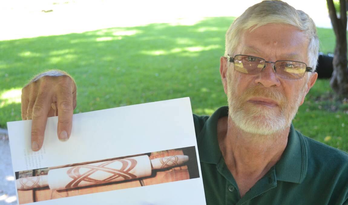 HELP SOUGHT: Central Tablelands Woodcraft secretary Paul Rodenhuis with an example of a rolling pin with a Celtic cross design. 032717rolling