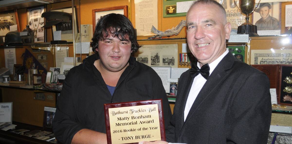 SNAPSHOT: Tony Burge from Mitchell's Transport receives his Matty Bonham Memorial Award from Peter Hagney at the Bathurst Truckies Ball. Photo:CHRIS SEABROOK 1126ctball1