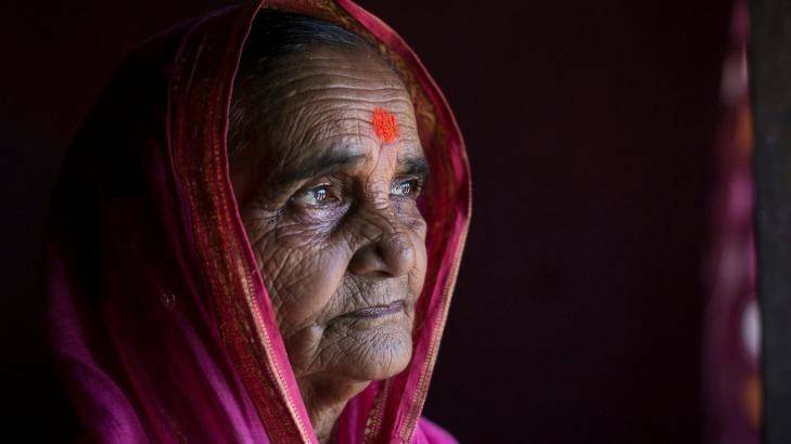 80-year-old Ramabai Ganpat Khandakle is one of 30 elderly women who are going to school for the first time in their life in the Thane district, India. Photo: Allison Joyce/Newslions