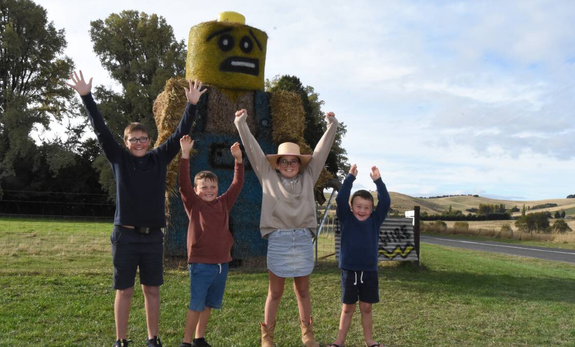 Ayden, Freddy, Cortnee and Kohen Pixton with their winning entry in the hay bale section of the Sculptures by the Bush competition in 2023. It was the family's first entry.