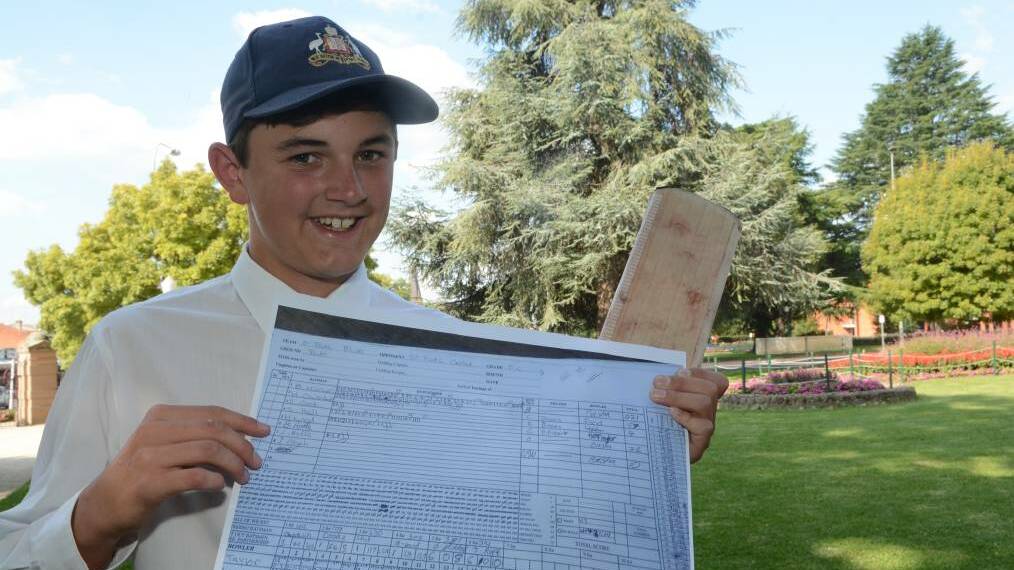 WOW: Ben Mitchell with a copy of the scorecard to remind him, in case he forgets, that at just 14 years of age he scored 221 on Saturday in President’s Cup. Photo: PHILL MURRAY