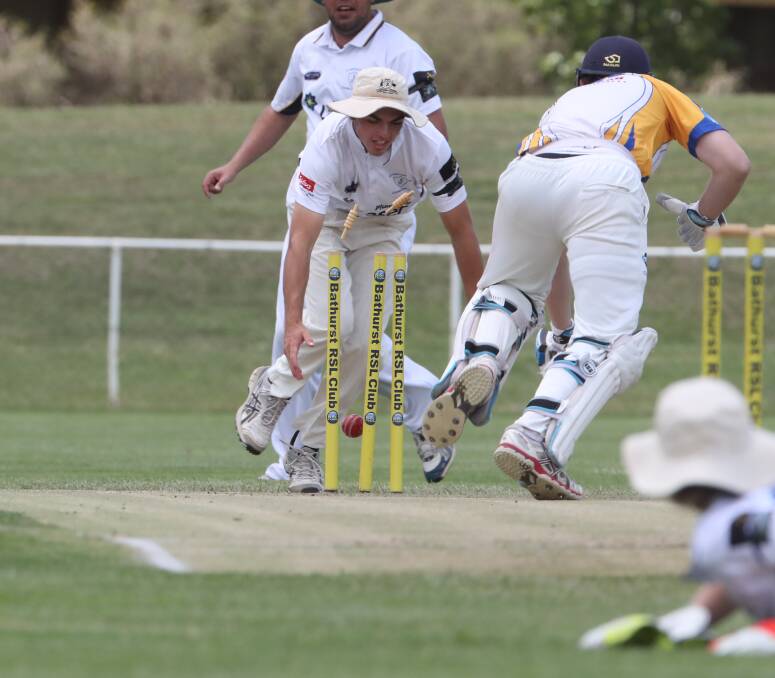 GOT HIM: While Rugby's Ryan Peacock scrambles to make his ground, the ball clatters into the stumps to remove him for a duck. St Pat's won the match by 39 runs. Photo: PHIL BLATCH 121617pbpats3