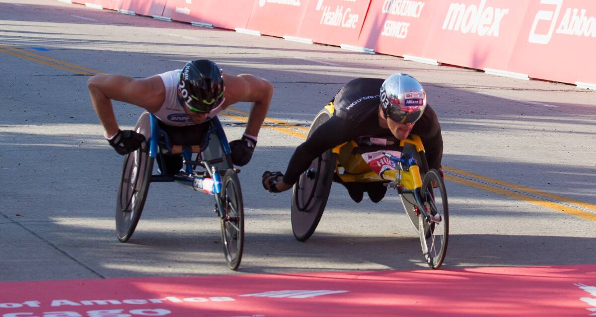SO CLOSE: Carcoar's Kurt Fearnley (left) is narrowly beaten to the line in Sunday's Chicago Marathon by Swiss rival Marcel Hug. Photo: GETTY IMAGES