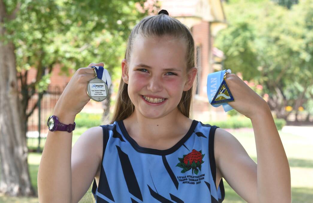 TOP EFFORT: Laura Scott shows off the her silver medal and team participation medal from the Trans Tasman Challenge. Photo: CHRIS SEABROOK