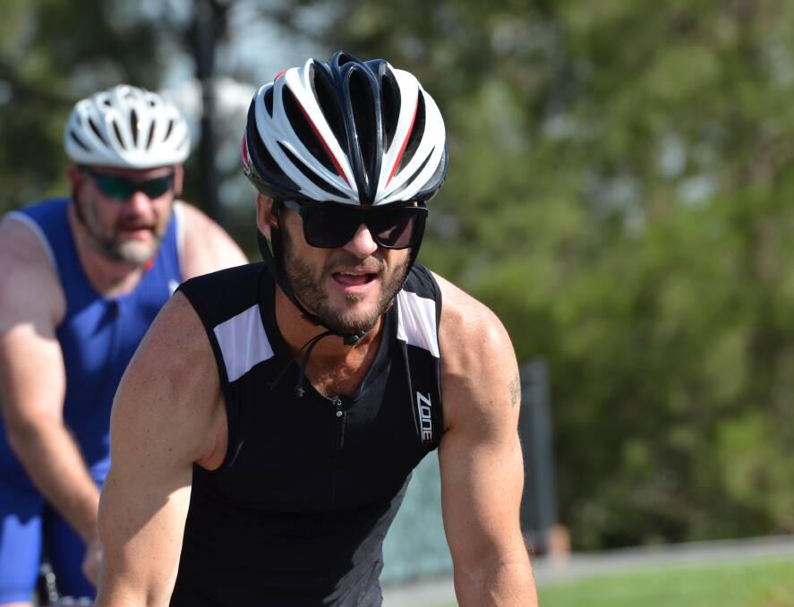 SHORT ORDER: Wes Gibson finishes off his cycle leg in Sunday's short course triathlon. He went on to take the lead in the run leg. Photo: ANYA WHITELAW