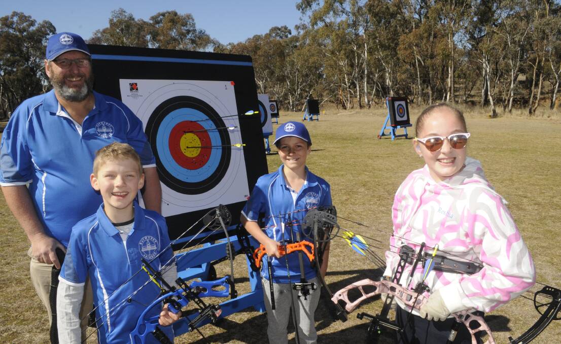 ON THE RANGE: Bathurst Archers' president Steve Olive with juniors, from left, Anthony Scorgie, Grayson Cross and Reshia Winfield. Photo: CHRIS SEABROOK 081317cbows1