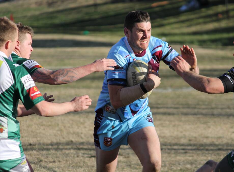ON THE RAMPAGE: Villages United co-coach Jarrod Gafa charges at the Blackheath defence in Saturday's major preliminary semi-final. Villages came from behind to win 24-20.