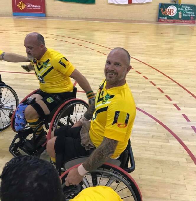 READY TO GO: Brett Henman offers a smile before taking on the French. Photo: WHEELCHAIR RUGBY LEAGUE AUSTRALIA FACEBOOK