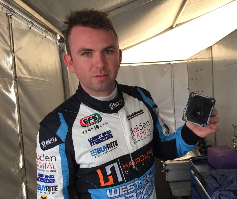 THE CULPRIT: Ryal Harris with the broken gear shifter which stopped him from driving in the V8 Utes opening practice session. Photo: ANYA WHITELAW