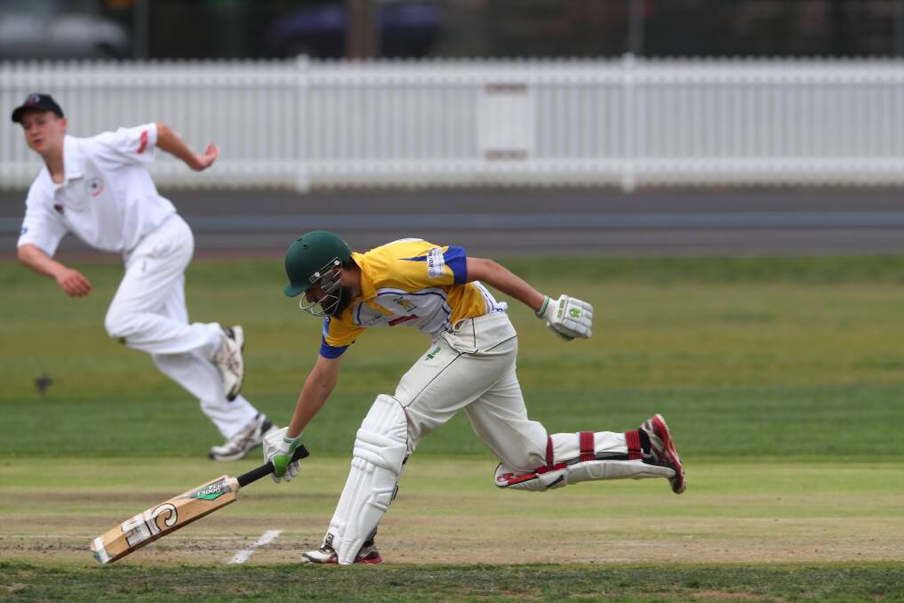 ANOTHER RUN: Imran Qureshi stretches out to notch up a run on his way to a well-made 114 against Bathurst City. Photo: PHIL BLATCH 