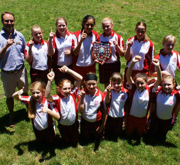 WE ARE THE CHAMPIONS: The Primary Schools Sports Association girls cricket champions, Blayney Public School. Photo: MARK LOGAN