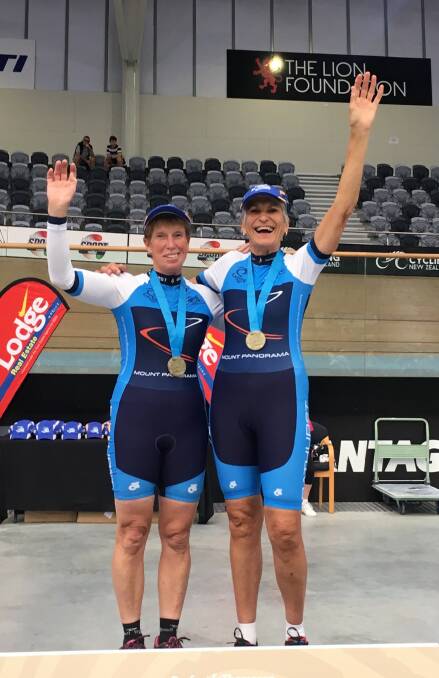 CELEBRATE: Bathurst cyclists Marian Renshaw (left) and Rosemary Hastings celebrate one of their successful rides at the World Masters Games in New Zealand.