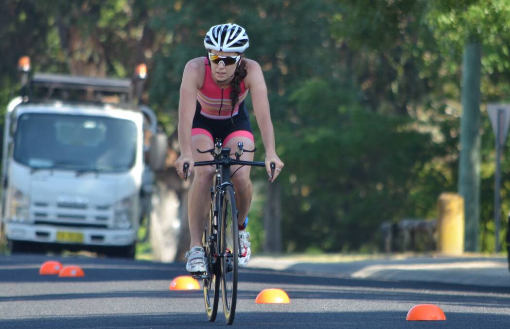 IN THE SADDLE: She may not enjoy swimming, but Kirsten Howard was a clear short course winner in Sunday's triathlon. Photo: ANYA WHITELAW 120416ytri9