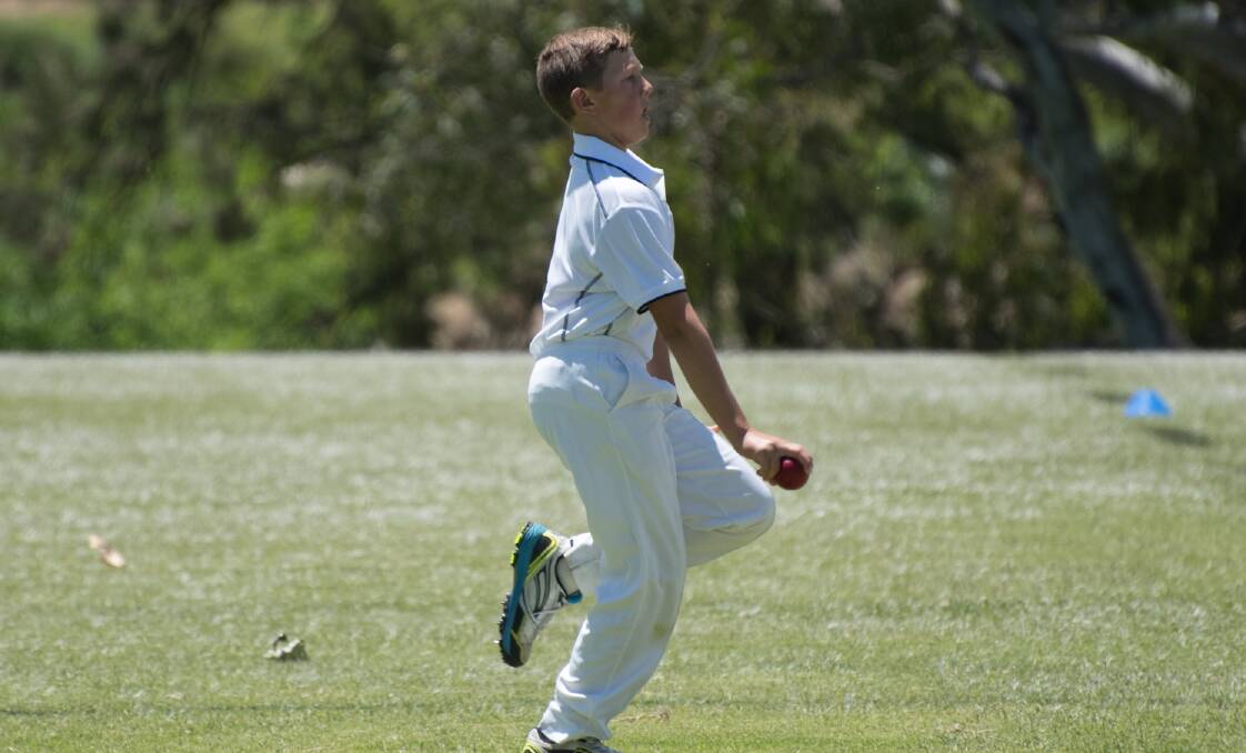 SEND IT DOWN: Bathurst's Angus Parsons prepares to let a delivery fly as he plays for the under 12 Mitchell Cricket Council side. Photo: MEG FRENCH
