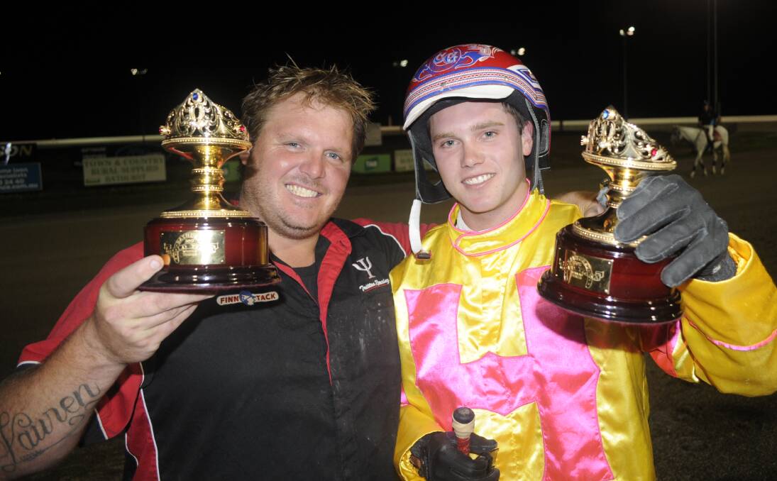 THE SPOILS: Trainer Shane Tritton and driver Chris Geary show off their Gold Tiara trophies. Photo: CHRIS SEABROOK 032519crown5a