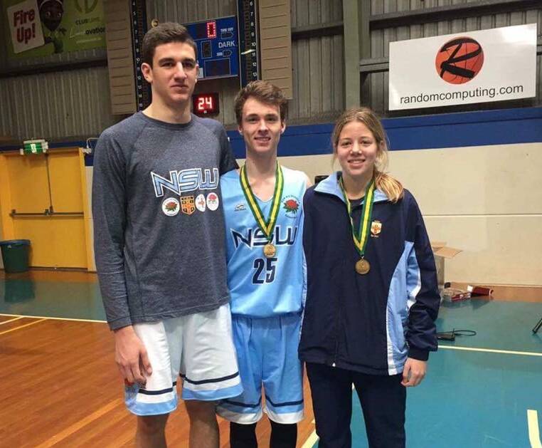 ON THE PODIUM: Bathurst Goldminers trio, from left, Matt Gray, Will Cranston-Lown and Sara Matthews made the finals of the School Sports Australia under 18 basketball titles.