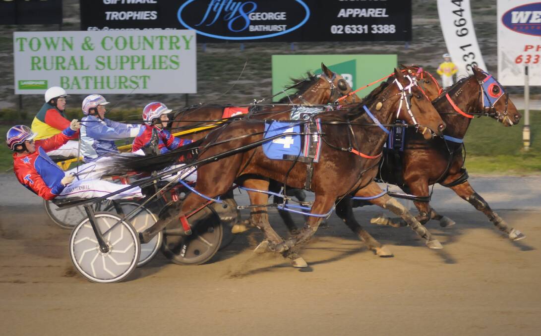 TIGHT FINISH: Conviction holds on to win a heat of the NSW Breeders Challenge three-year-old colts and geldings series. Photo: CHRIS SEABROOK 052417ctrots1