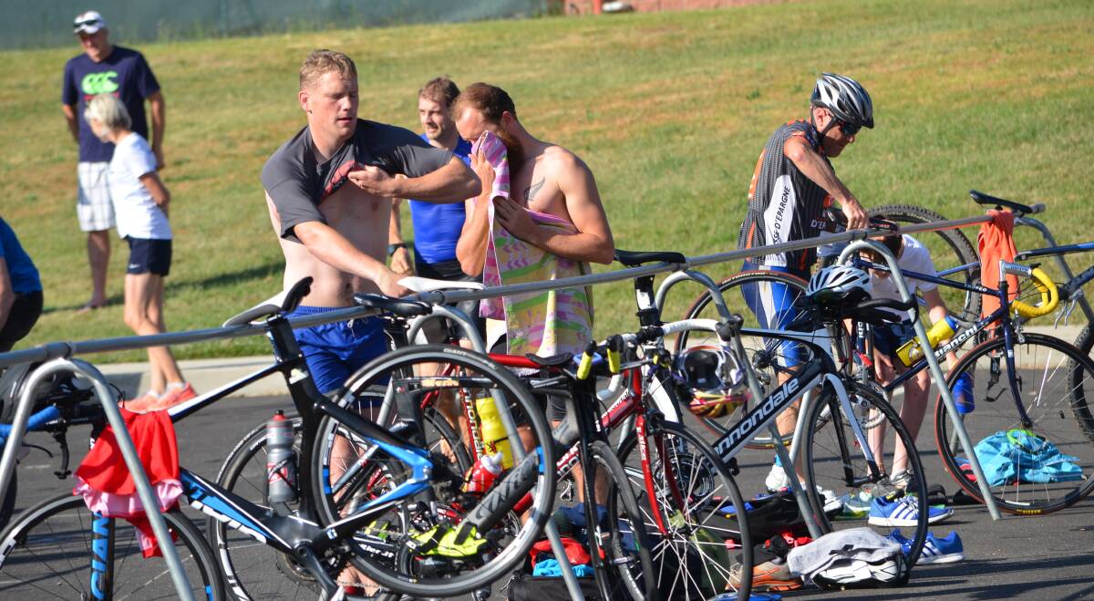 NEXT JOB: Competitors prepare for the cycle leg.