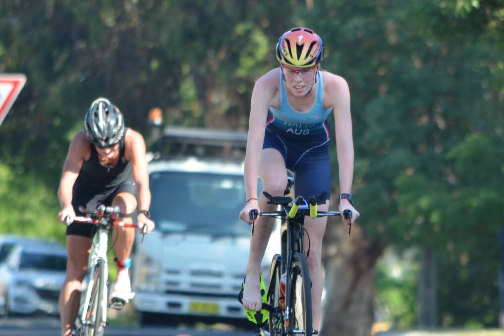 ALMOST DONE: Long course winner Emily Watts turns over the pedals as she nears the end of the 16.5km bike leg. Photo: ANYA WHITELAW