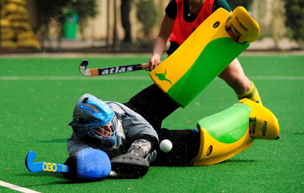 DENIED: Toni Cronk makes a save during her time as Hockeyroos goalkeeper. She will run clinics in Bathurst this weekend.