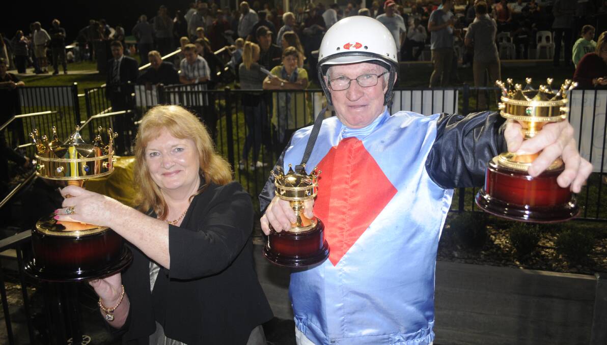 HAPPY COUPLE: Owners Betty and Geoff Simpson were delighted to win Saturday night's Gold Crown Final with Castalong Shadow. Photo: CHRIS SEABROOK 032517crown7b
