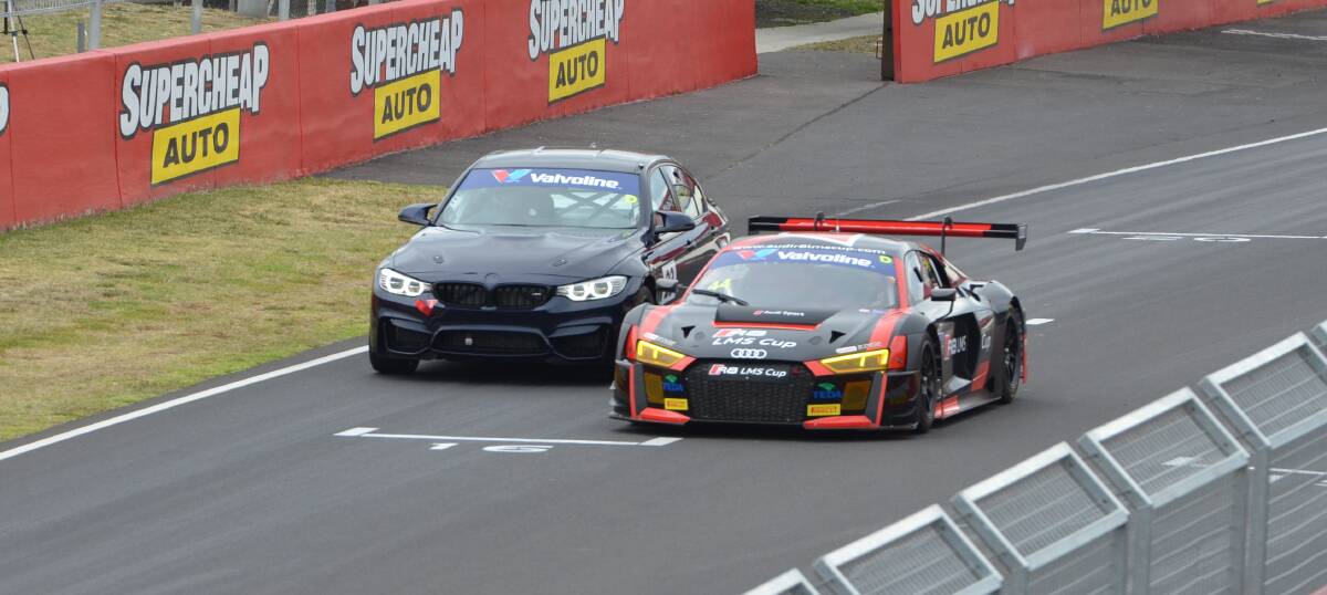 COMING THROUGH: Audi driver James Koundouris passes a rival at Mount Panorama during a Group D Supersprint session on the the opening day of Challenge Bathurst. Photo: ANYA WHITELAW