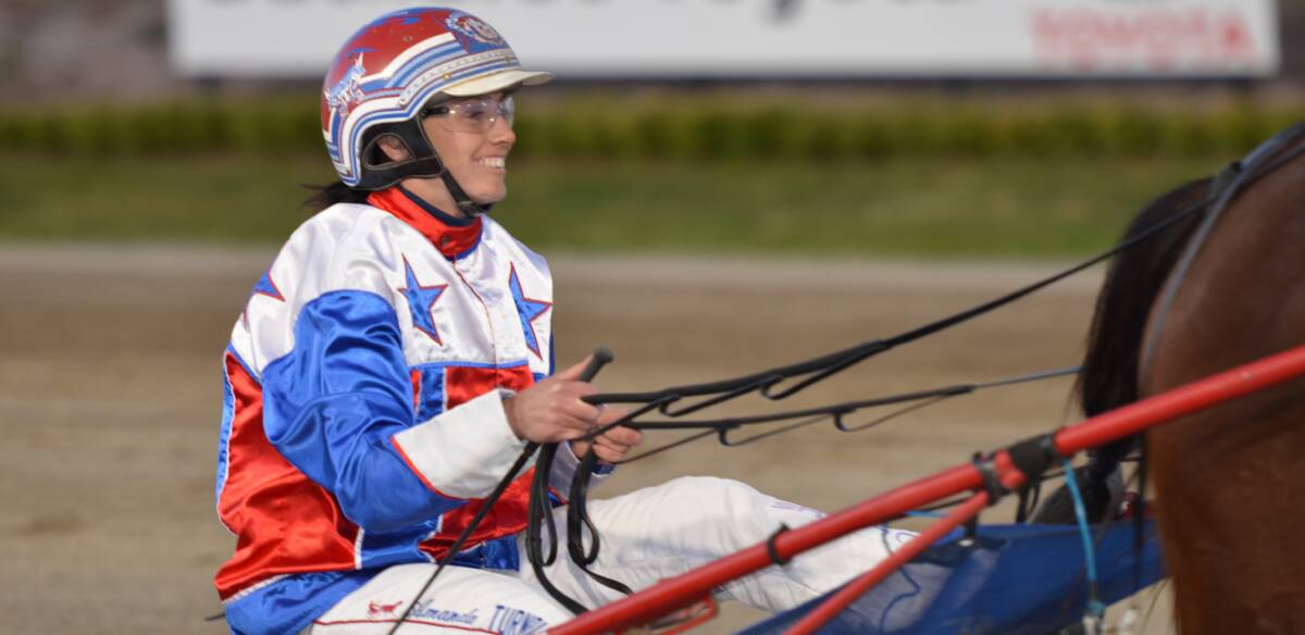 SMILING ASSASSIN: Amanda Turnbull produced another stellar drive to help Hey Porsha to victory at the Bathurst Paceway on Friday night. Photo: ANYA WHITELAW