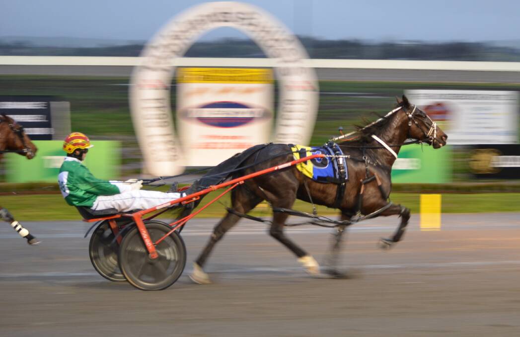 WINNER: Chris Geary took out the opening race at the Bathurst Paceway on Wednesday night with Express Pass. Photo: ANYA WHITELAW 082416ytrots1