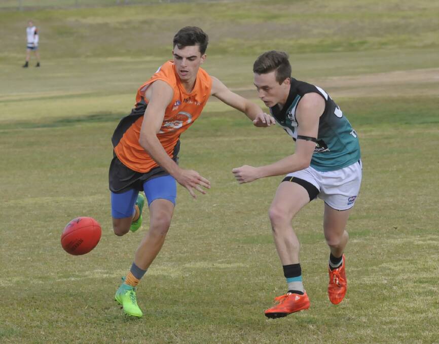 TAG TEAM: Bathurst Giant Nic Broes (left) will tag Outlaws' full forward Tim Hunter in Saturday's Central West AFL match between the pair at George Park. It will be the Giants' last game of the season. Photo: CHRIS SEABROOK 052017cafl1