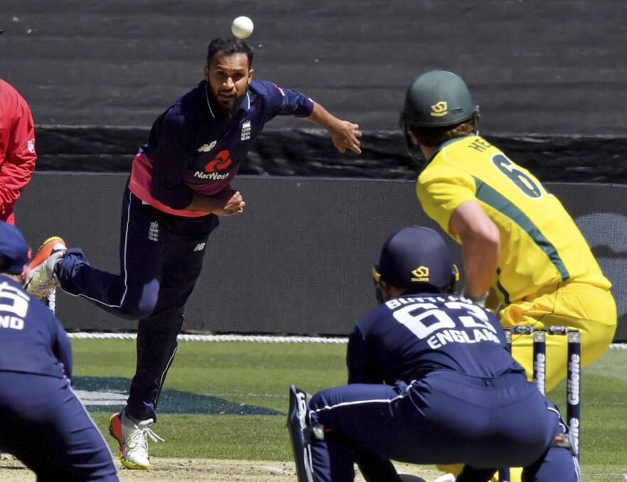 IMPRESSIVE: Trent Copeland liked what he saw from England's Adil Rashid, pictured bowling to Australia's Travis Head, in the first one-dayer. Photo: AP PHOTO