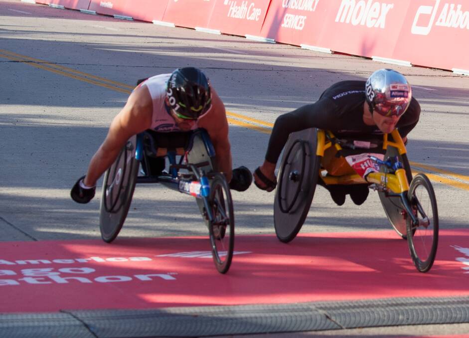 GREAT RIVALS: Swiss ace Marcel Hug - who wears a distinctive silver helmet - has had the better of Kurt Fearnley in their recent meetings on the elite men's wheelchair marathon circuit. Photo: GETTY IMAGES