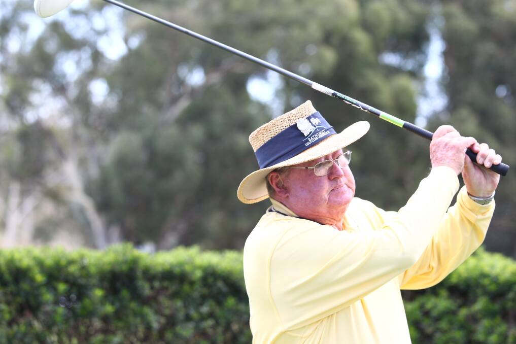 FOCUS: Sel Coles watches his tee shot during a recent round at the Bathurst Golf Club. Photo: PHIL BLATCH 020417pbgolf1