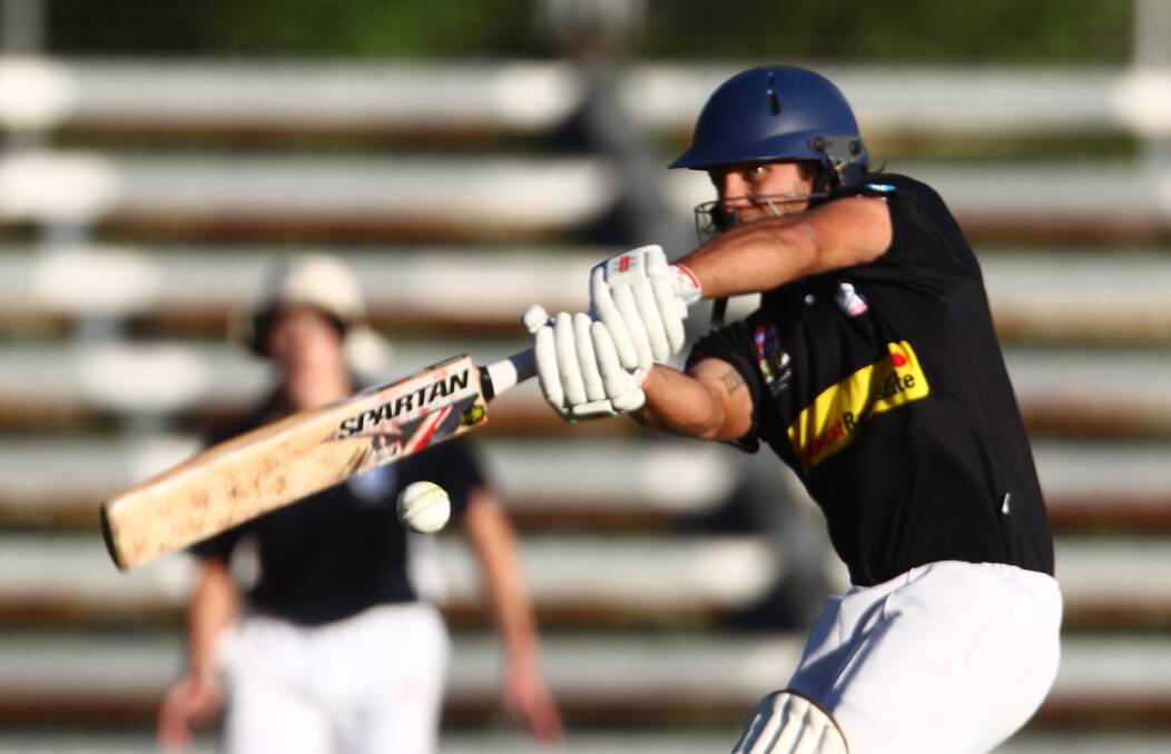 OFF THE MIDDLE: Redbacks opener Joey Coughlan smashes one away on Friday night when his Bathurst City side thumped Kinross. Photo: PHIL BLATCH 1125pbcrick2