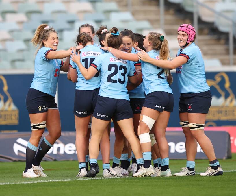 Bathurst talent Jacinta Windsor, in jumper #23, celebrates a try with her NSW team-mates on Saturday. Picture by Sitthixay Ditthavong