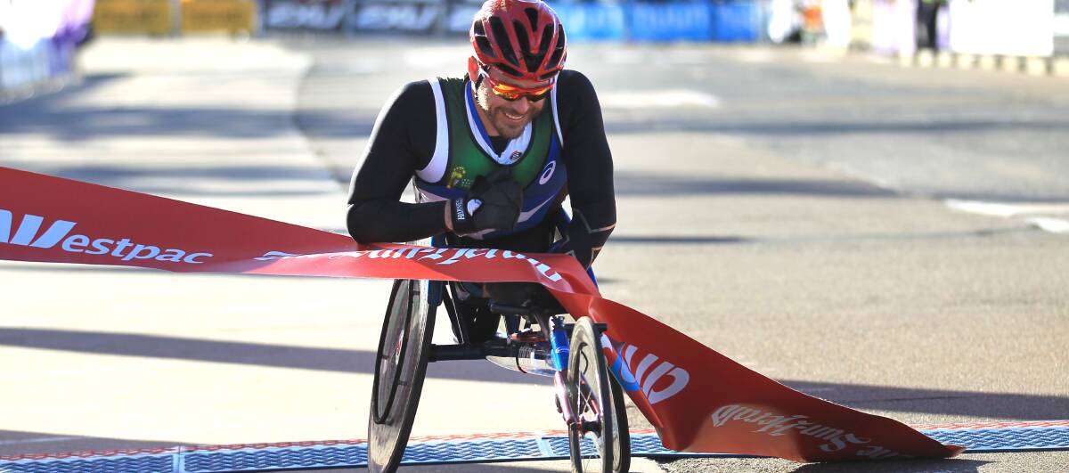 YOU BEAUTY: Kurt Fearnley picks up his fifth City2Surf win on Sunday, the Carcoar champion having fixed a loose wheel along the way. Photo: JAMES ALCOCK