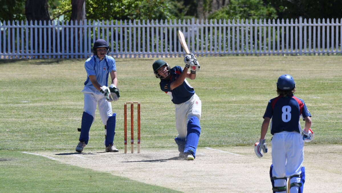 BANG: Western batsman Brock Larance goes whack back over the bowler's head in his knock of 47 on Tuesday. Western hung on to beat ACT Southern by 10 runs on day two. Photo: CHRIS SEABROOK