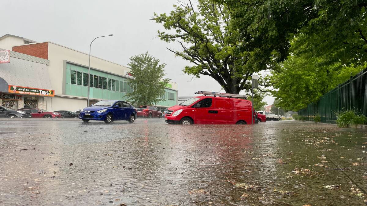 Flash flooding near cars parked on Kite Street. Picture by Nick McGrath